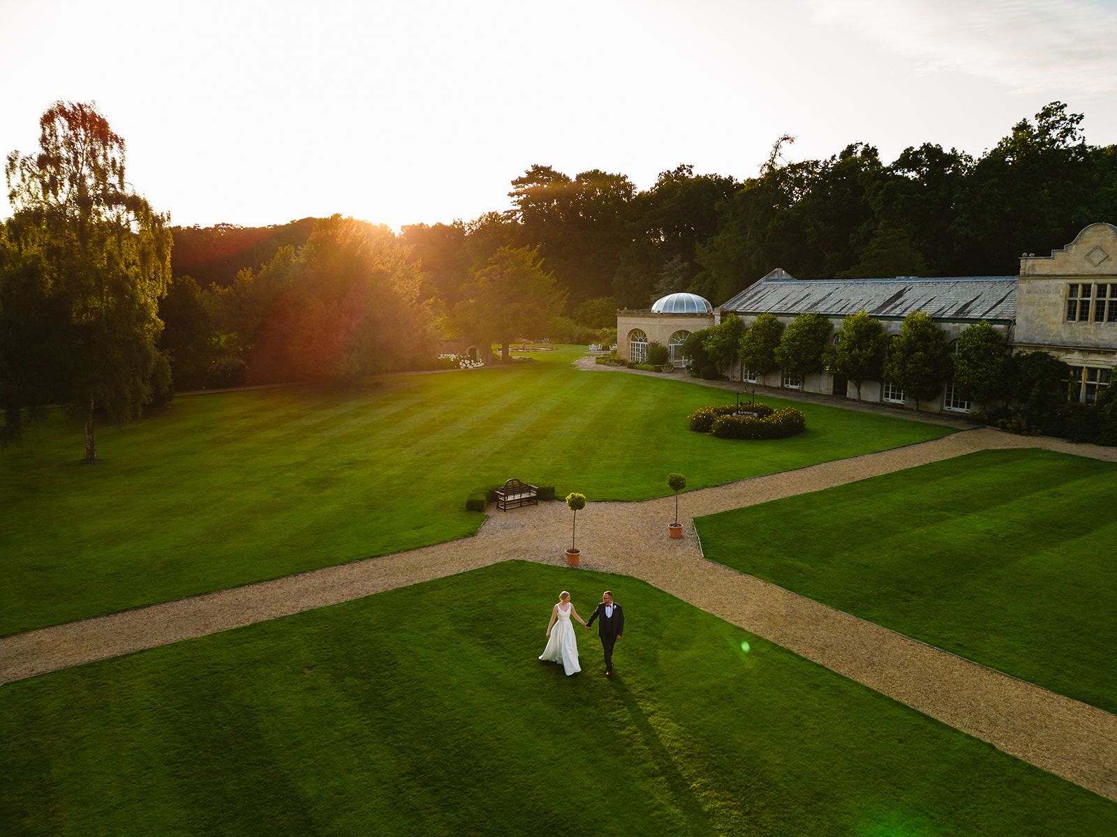 Drone photograph of a couple at sunset for their wedding at Stapleford Park by Amanda Forman Photography