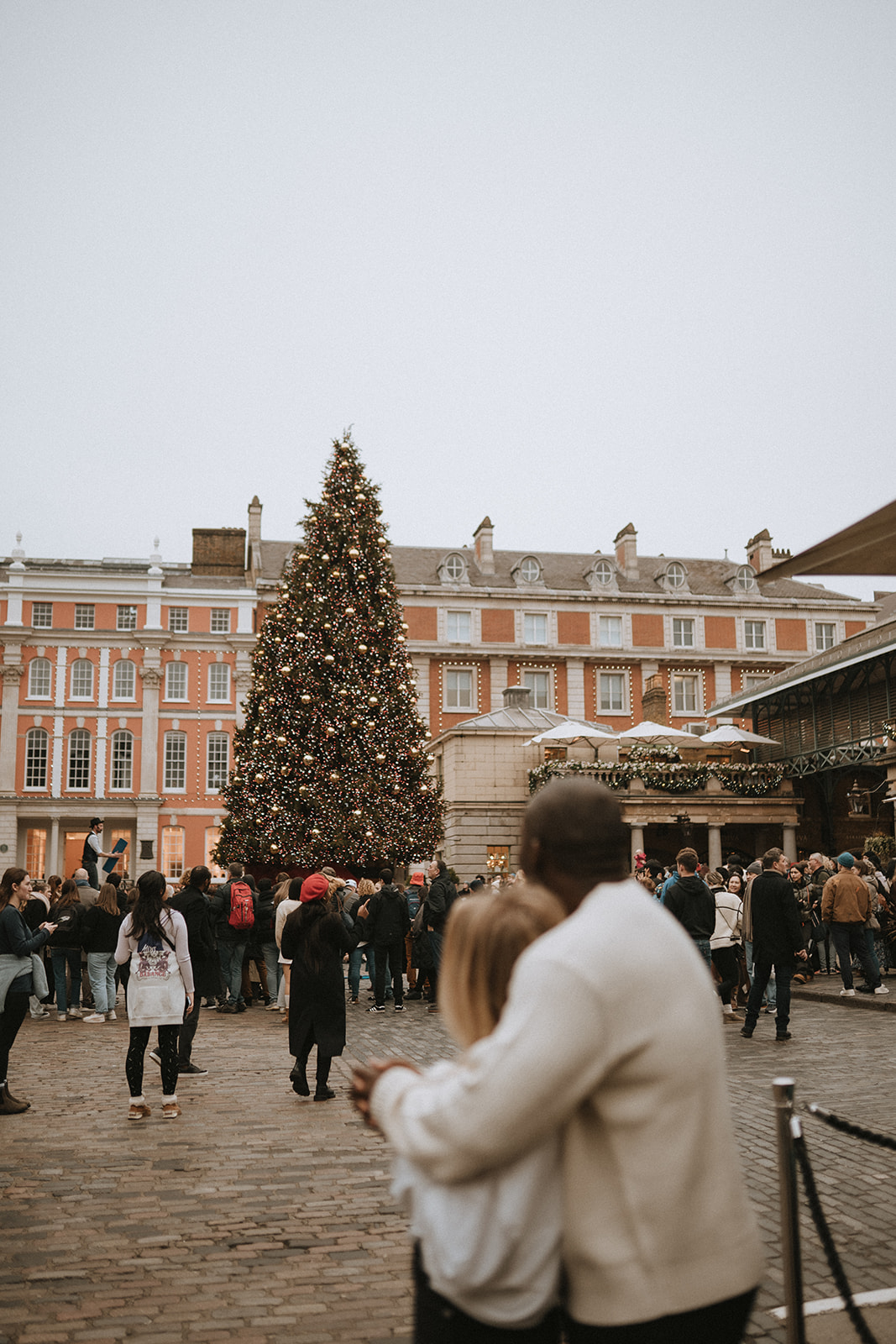 couple looking at the Christmas tree in Covent Garden