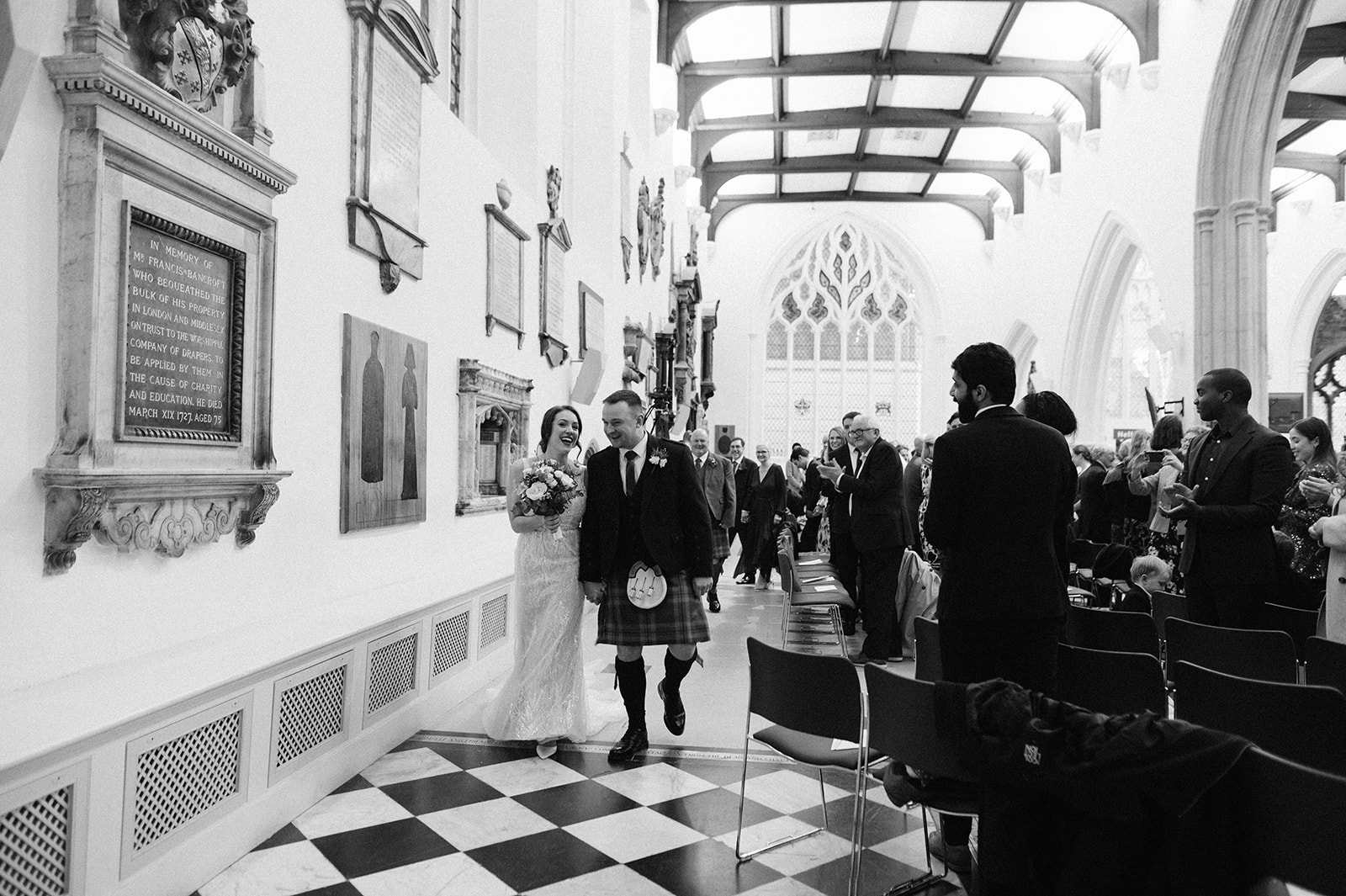 Bride and groom leaving St Helen's Church Bishopsgate after their wedding