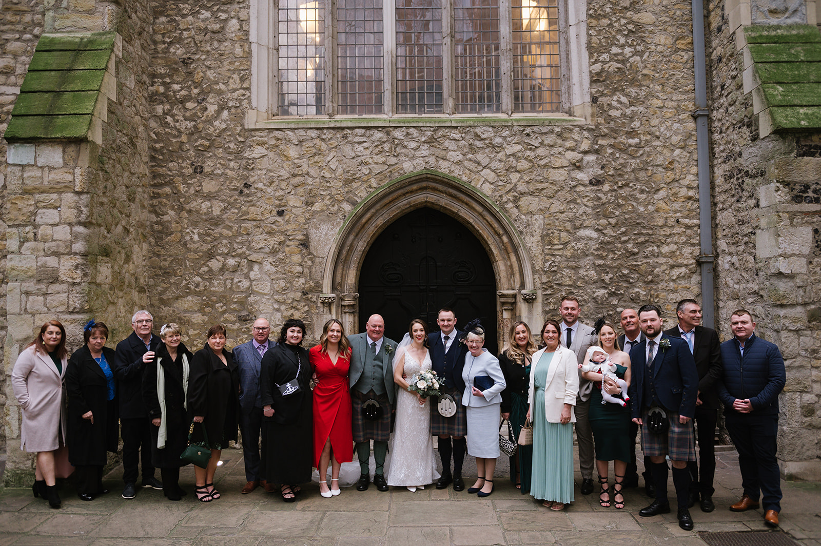 wedding group photos at St Helen's Church Bishopsgate after their wedding