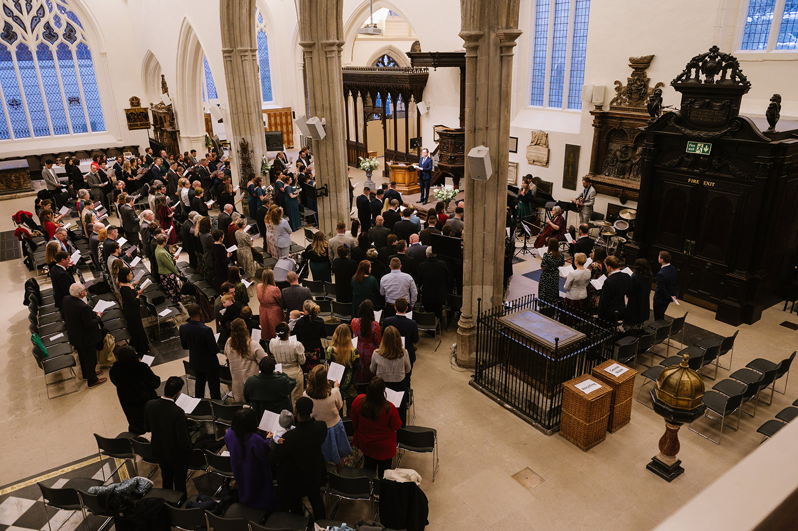 Wide shot of all the wedding guests at St Helen's Church Bishopsgate