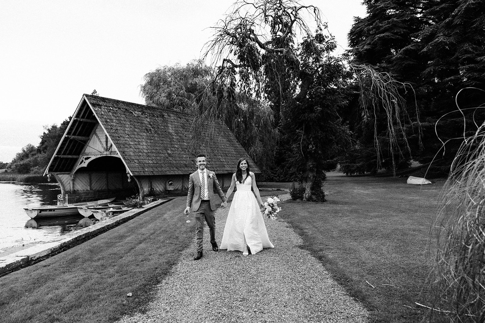 bride and groom at boathouse