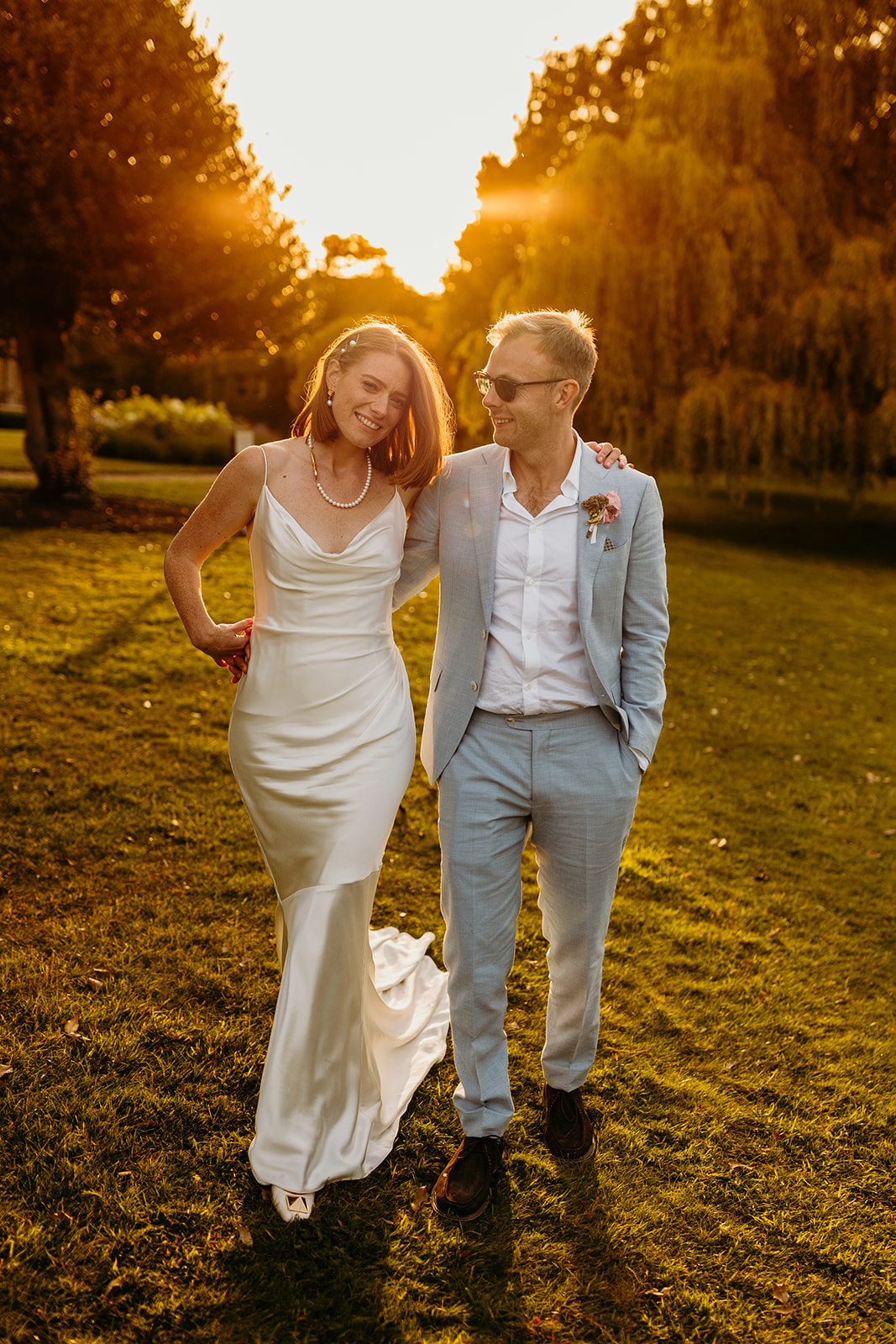 sunset photographs of bride and groom at Oakley Court wedding