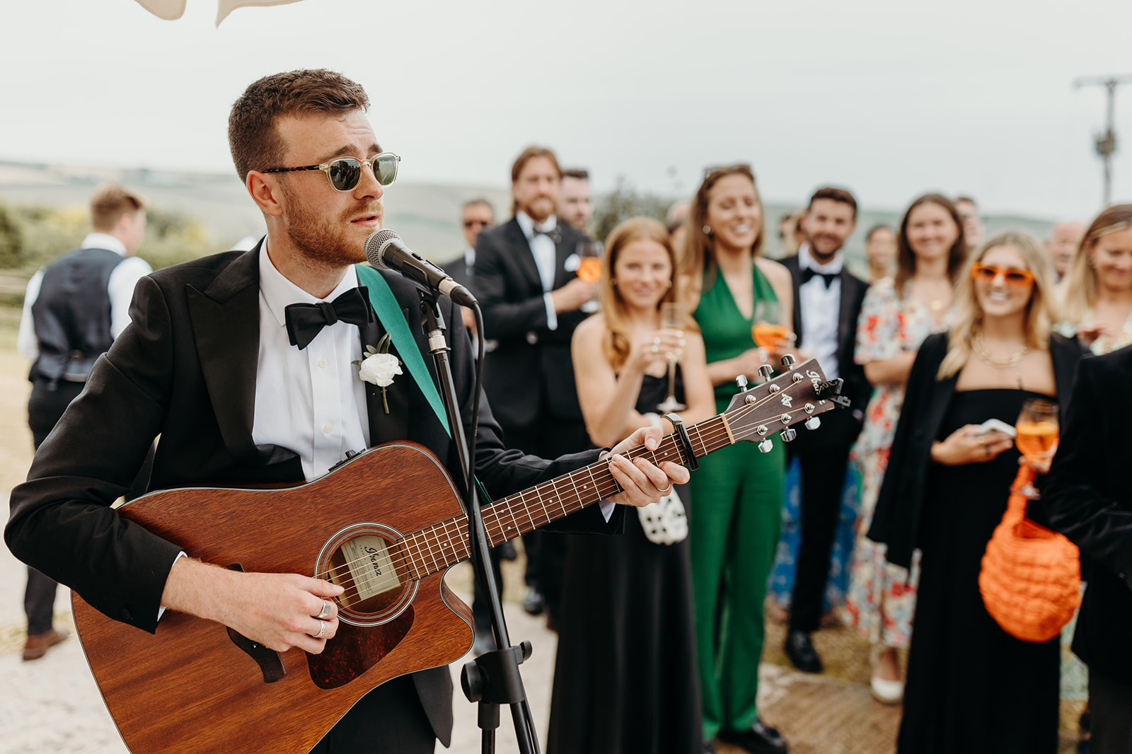 Groom's brother sings for couple as they arrive at wedding reception