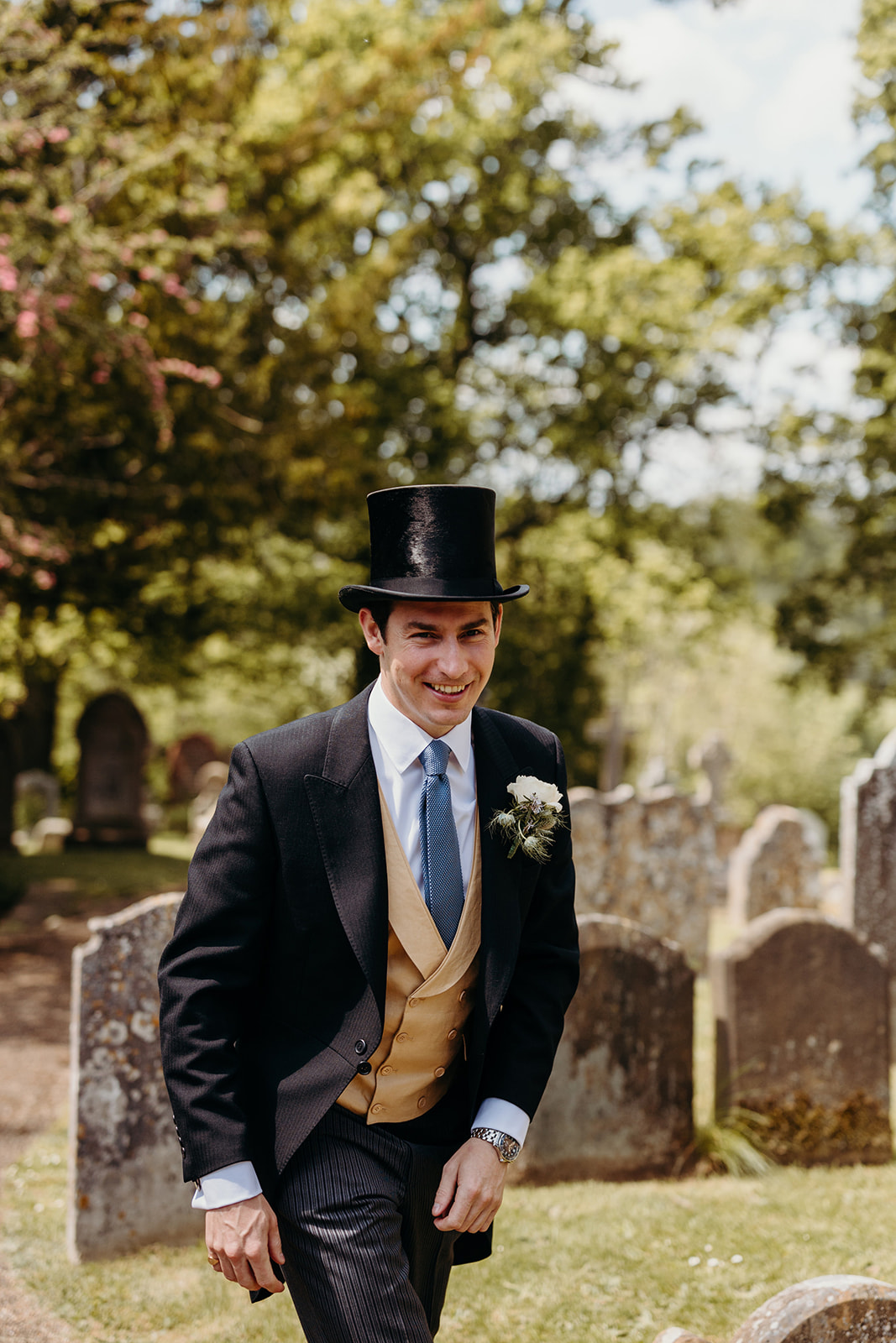 Ed sporting a top hat, adding aristocratic flair to the country house wedding in East Sussex.