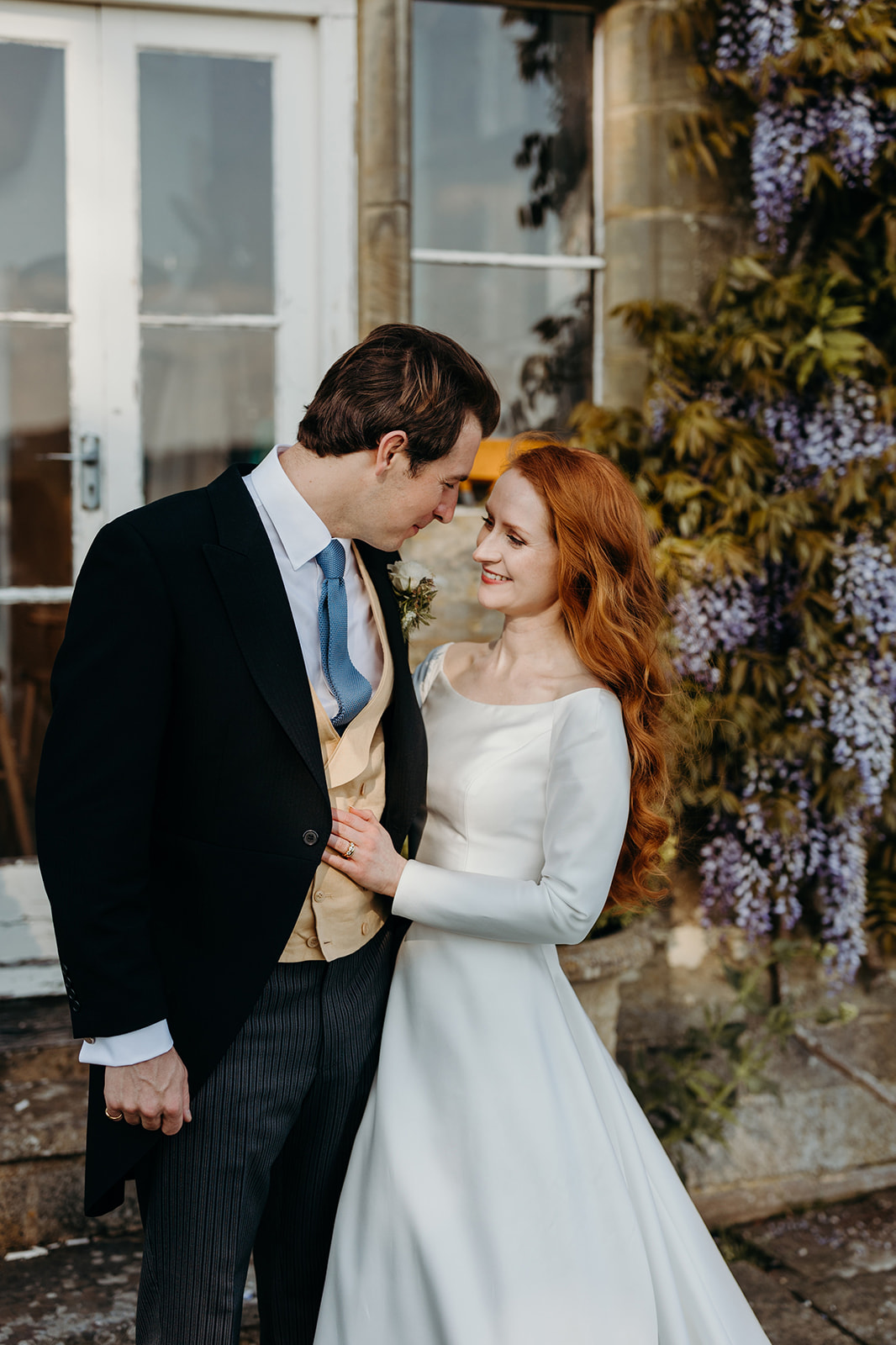 Capturing the couple against the dramatic backdrop of the Buckhurst Park mansion.