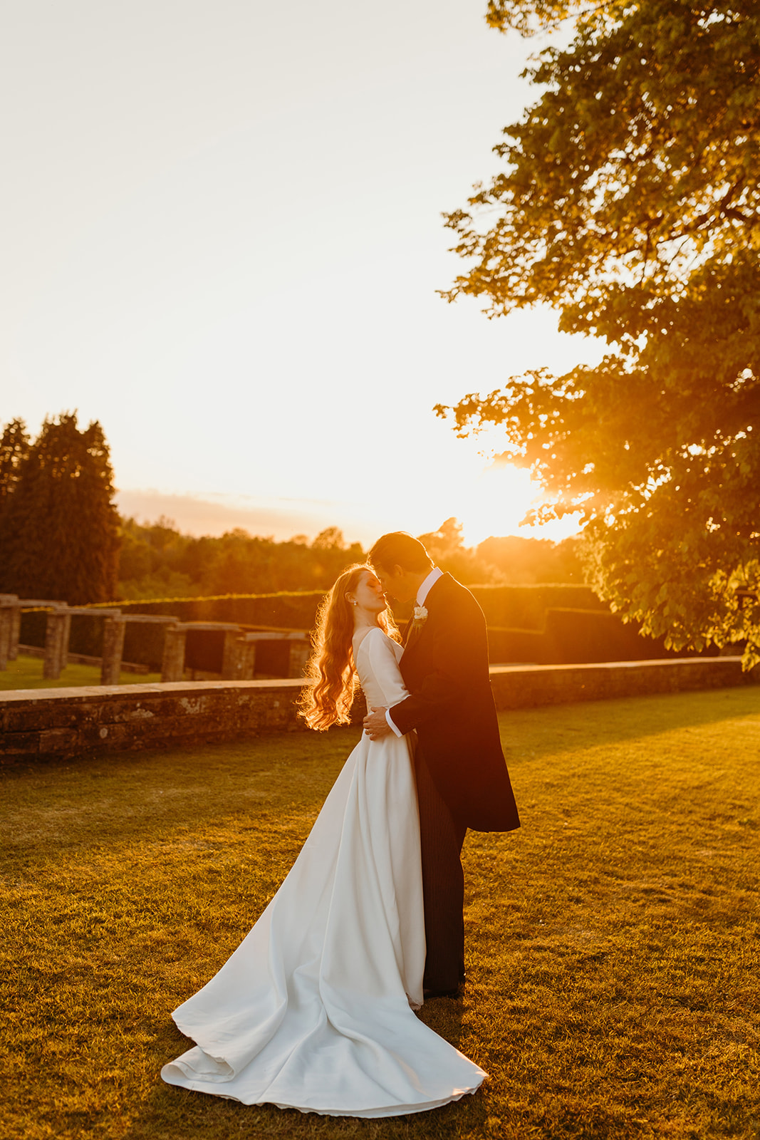 Stunning portraits of Kate and Ed at sunset on the Buckhurst Park estate grounds.