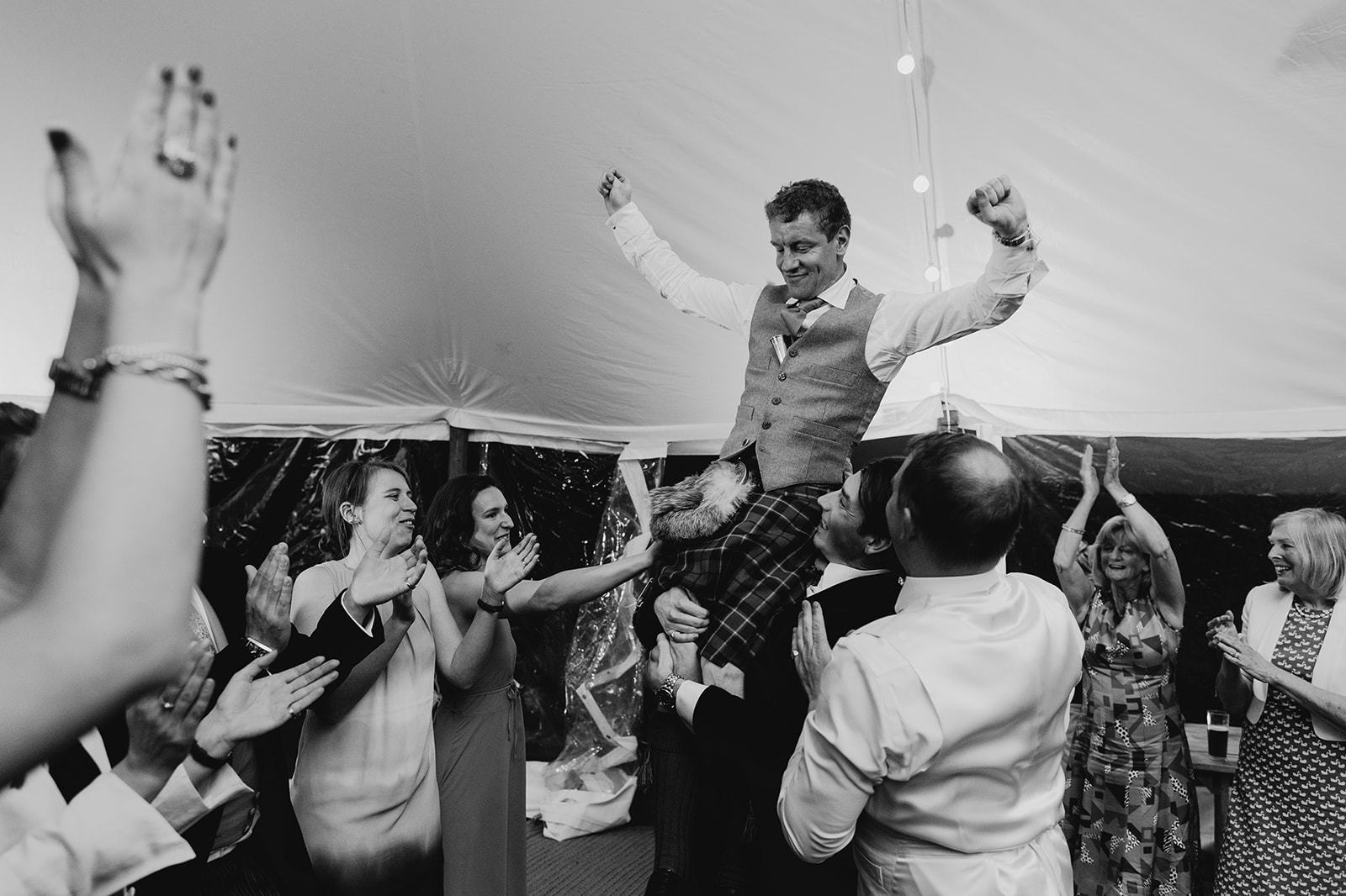 Laughter and dance filling the marquee at the Withyham country house wedding.