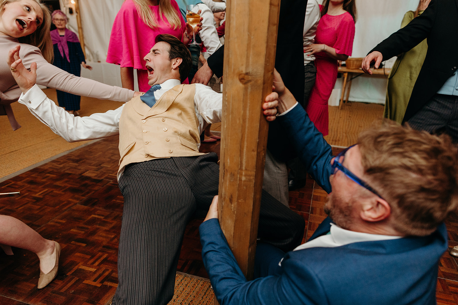Guests showcasing occasional acrobatic feats at the East Sussex marquee wedding.