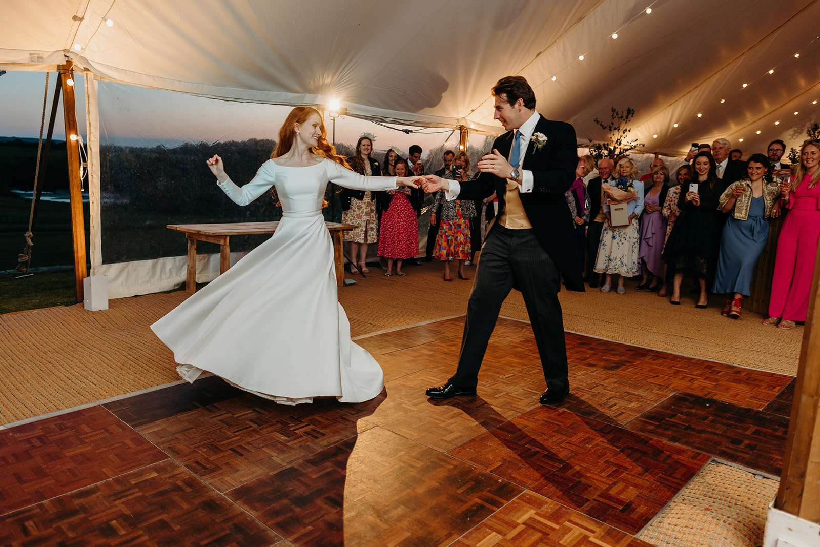 first dance of bride and groom at country house marquee wedding