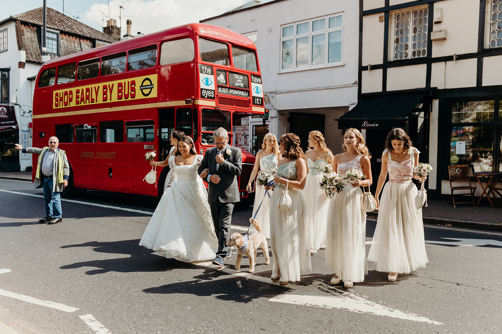 bride arrives with bridesmaids in red London bus for Richmond wedding