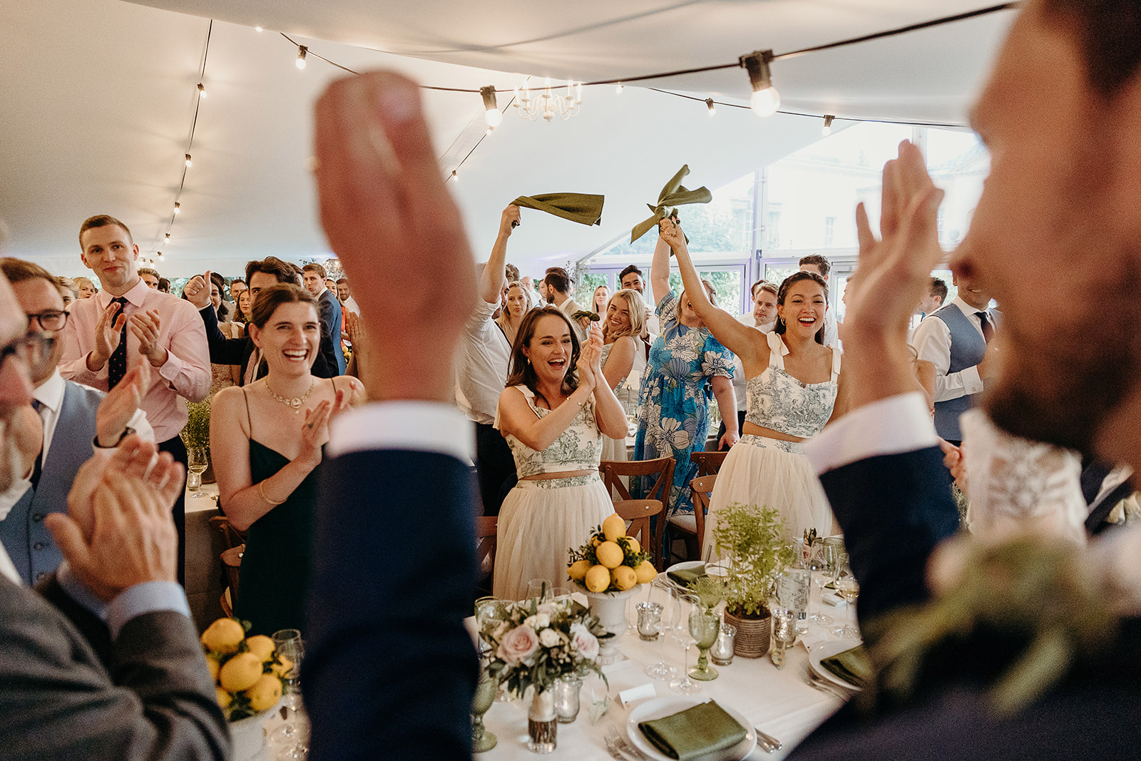 guests wave their napkins as bride and groom enter Marquee a Richmond wedding 
