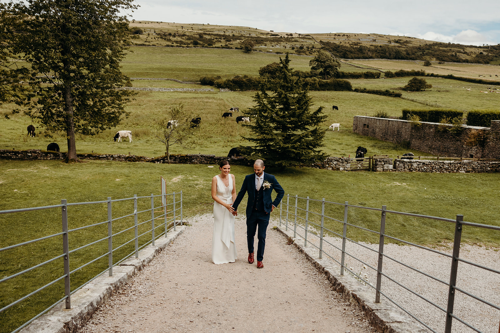 bride and groom make entrance with lake district scenery in the background