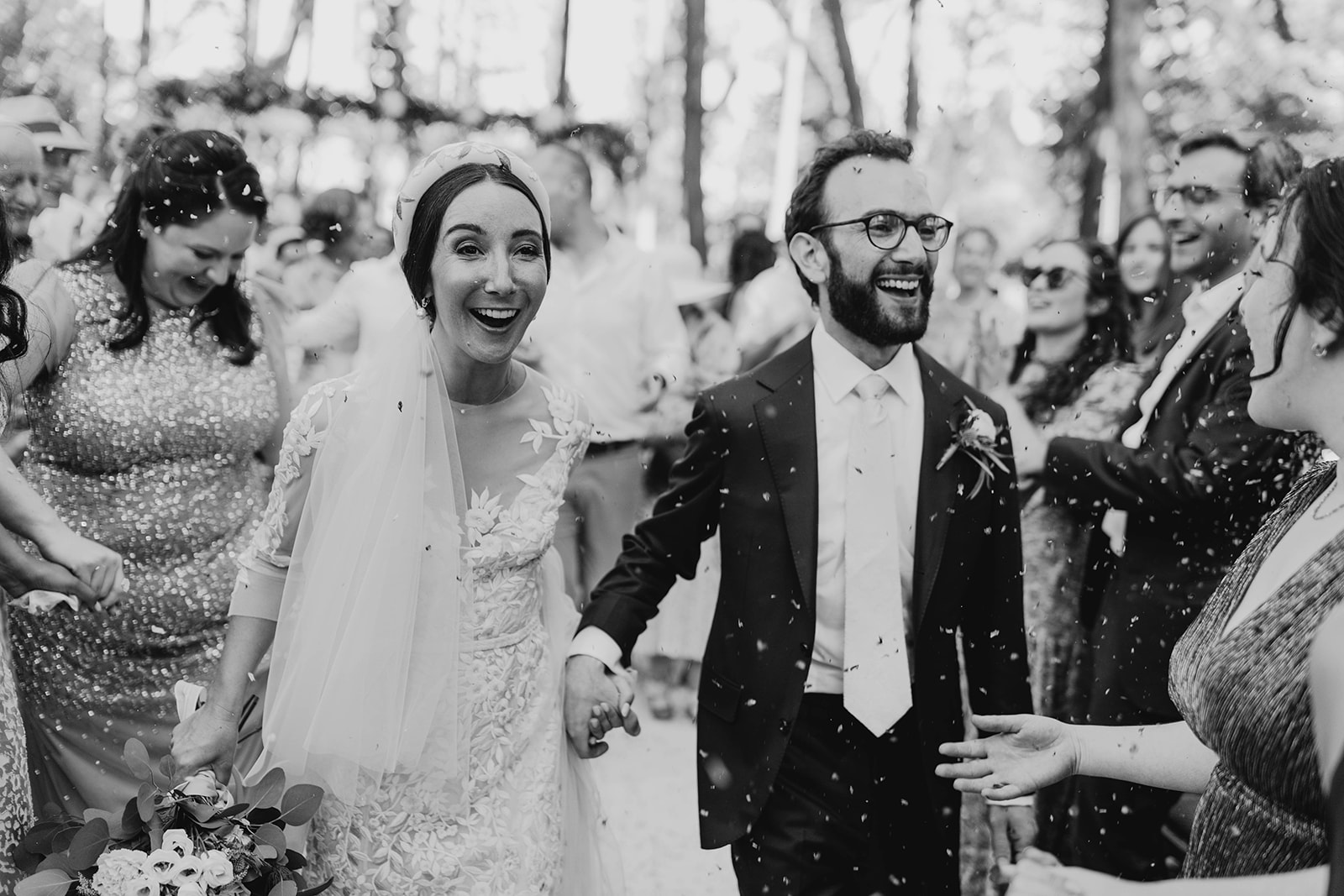 bride and groom walk down aisle after just getting married
