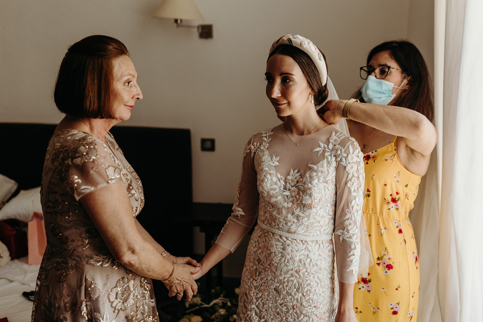 Brides mum holds daughter hand as she gets ready for wedding