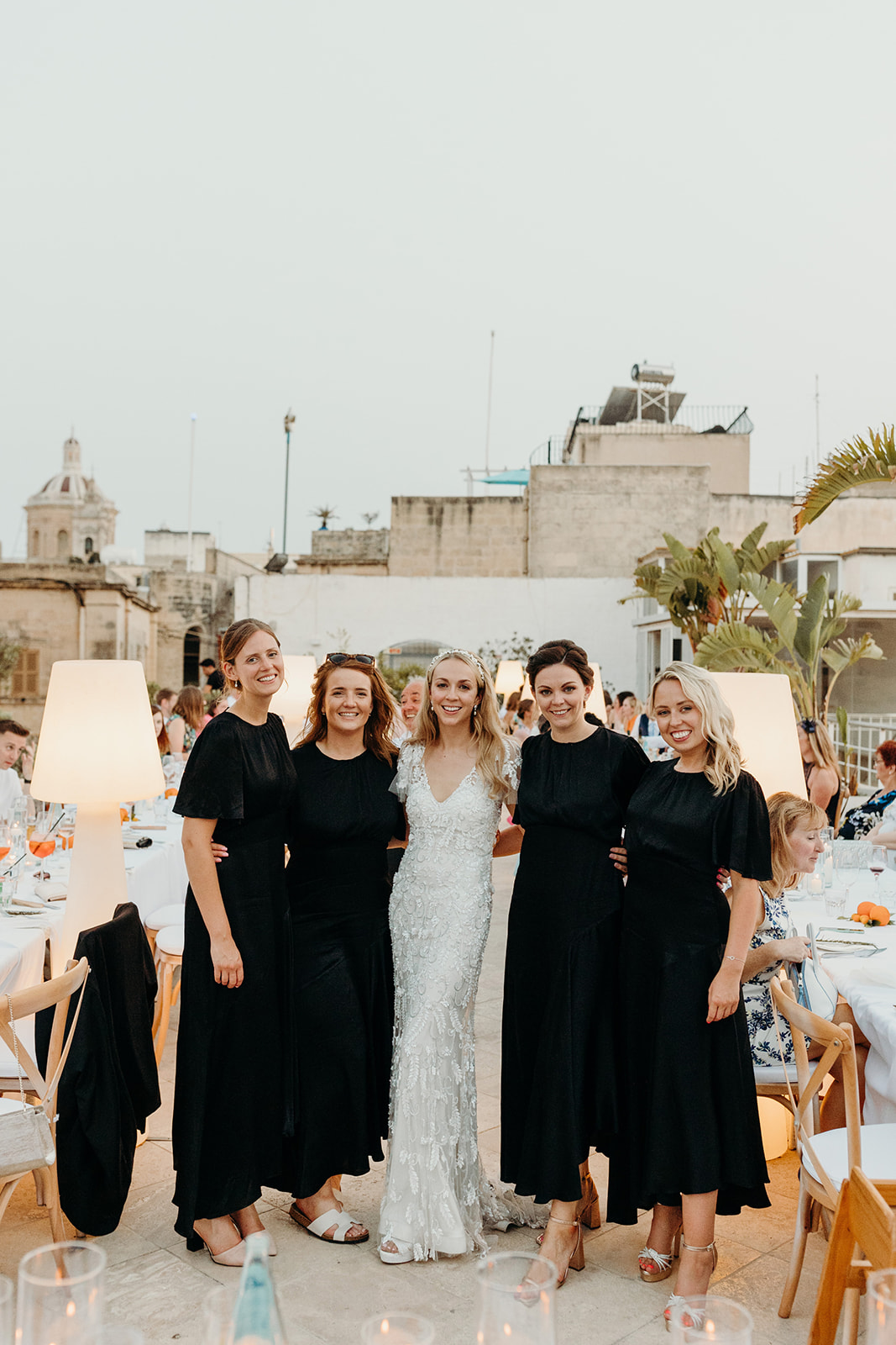 Bride with bridesmaids at rooftop celebrations at Palazzo Castelletti