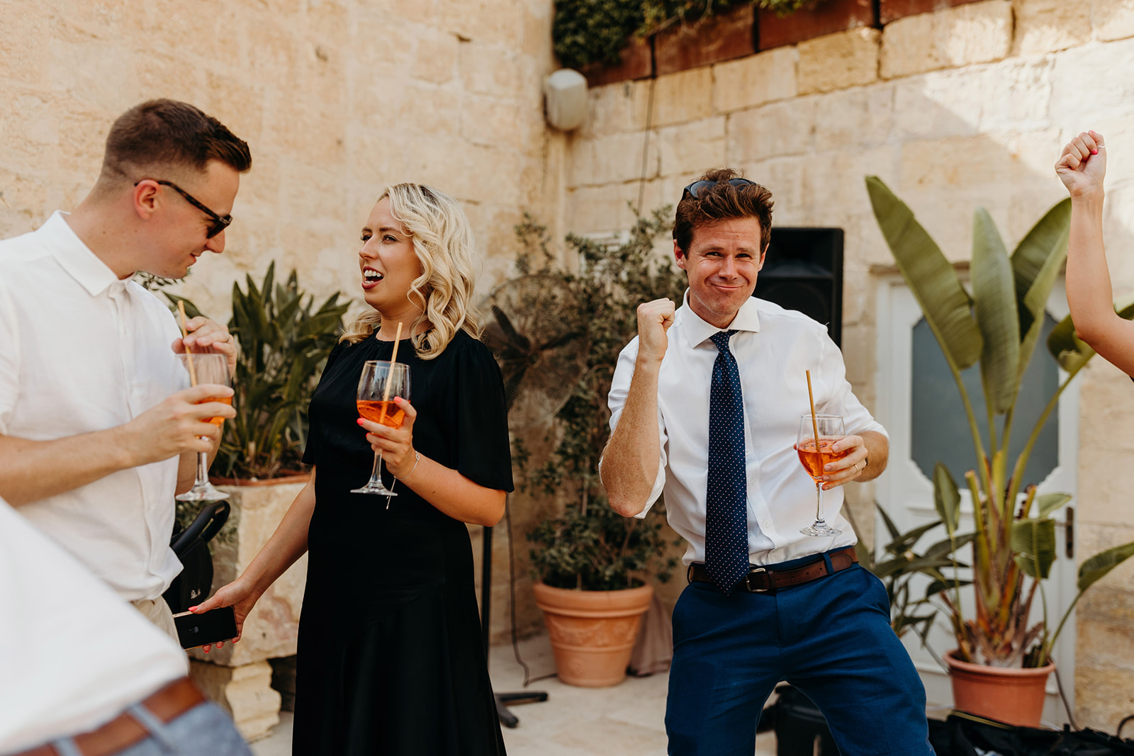Guests enjoy a drink at Palazzo Castelletti drinks reception at wedding 