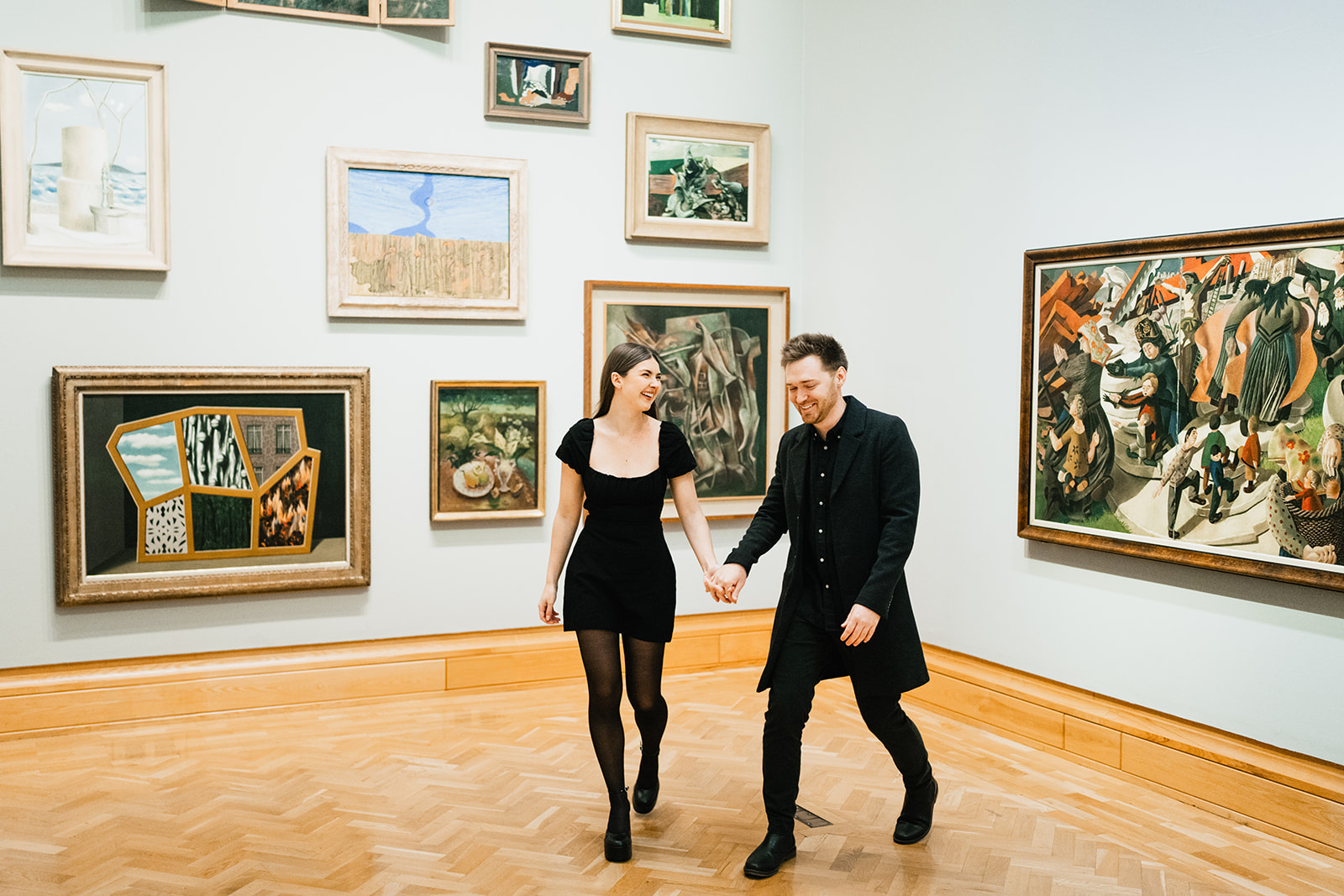 couple admiring art work in an art gallery cardiff