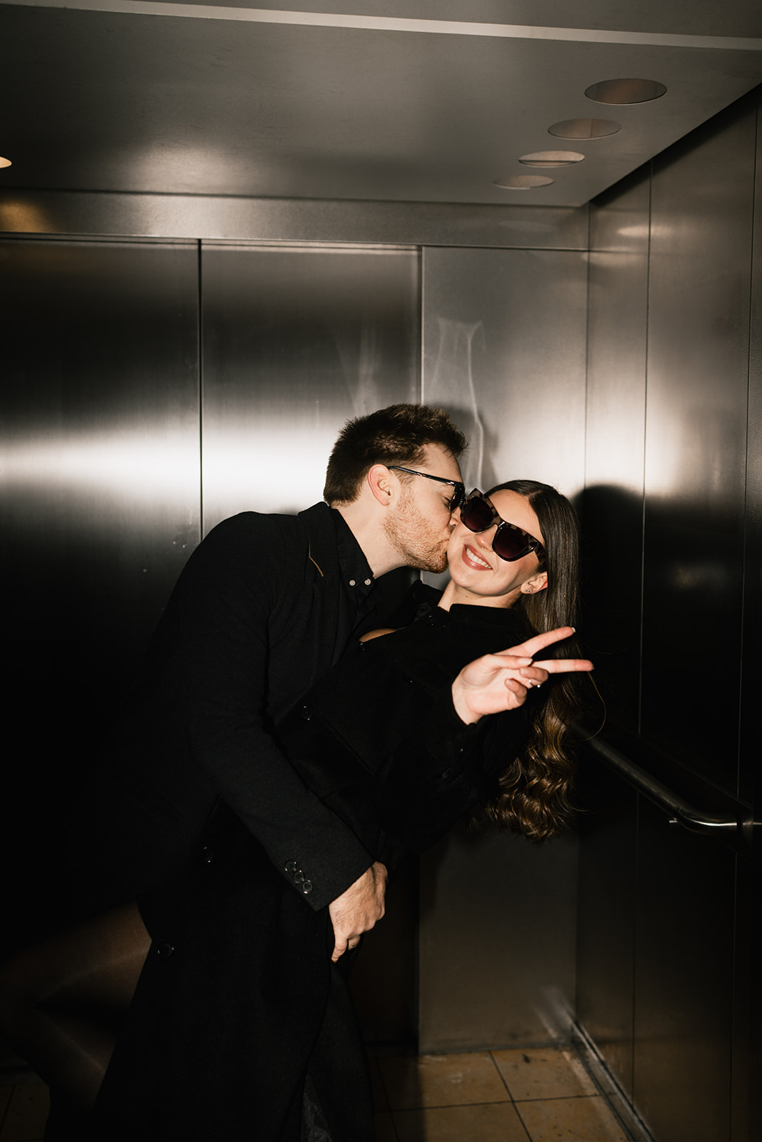 couple photos in an elevator