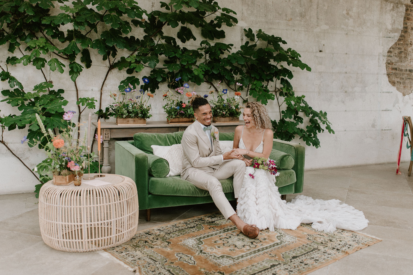 bride and groom sitting on sofa in luxury wedding venue Middleton lodge