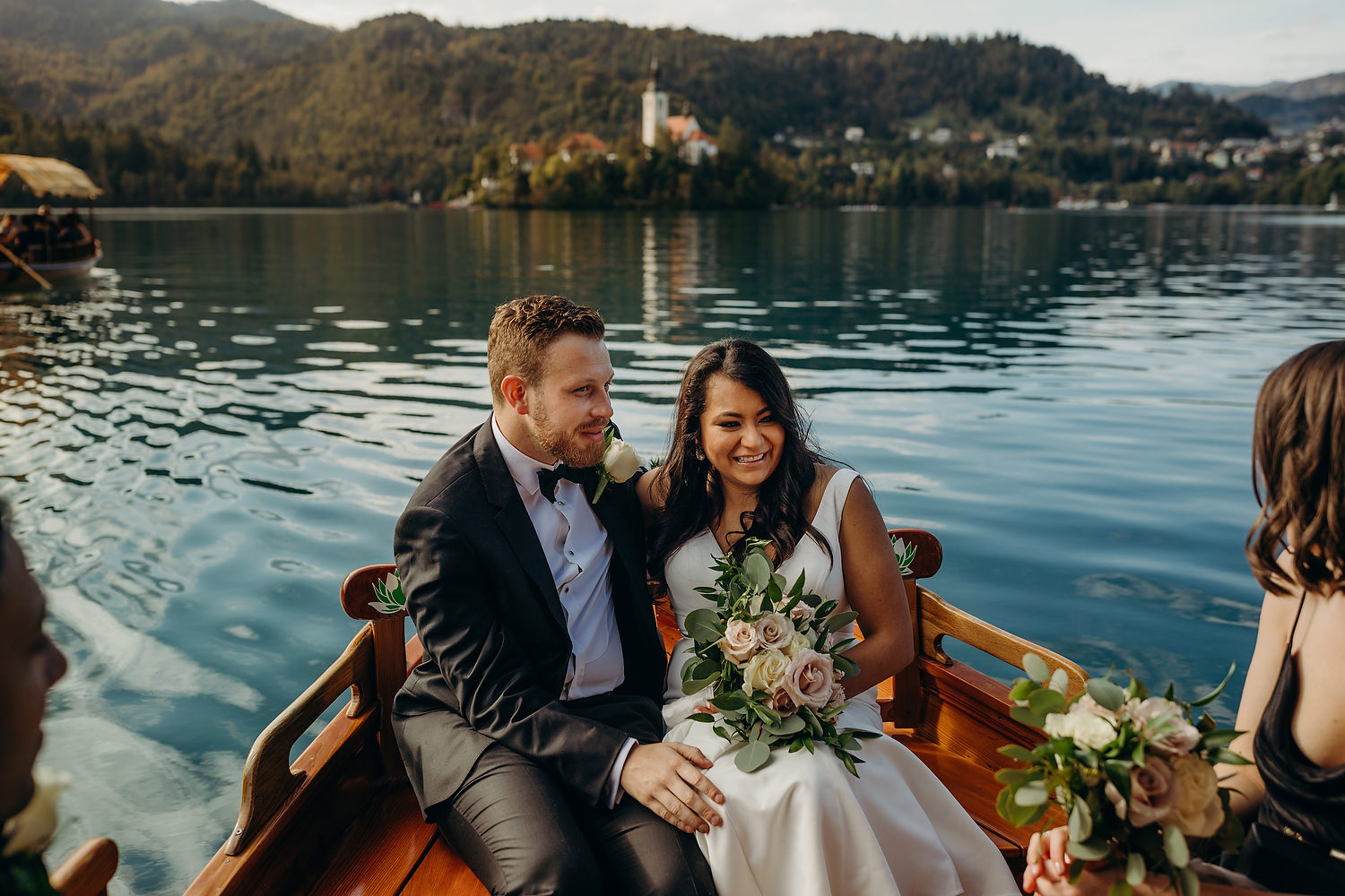 bride and groom get a boat trip to island on lake bled