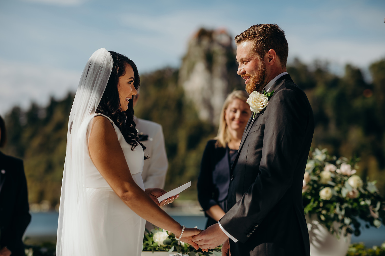 couple look at each other during outdoor ceremony at the Grand Toplice hotel in Slovenia