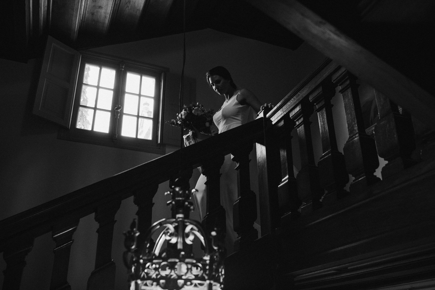 bride walking down the stairs at chateau wedding