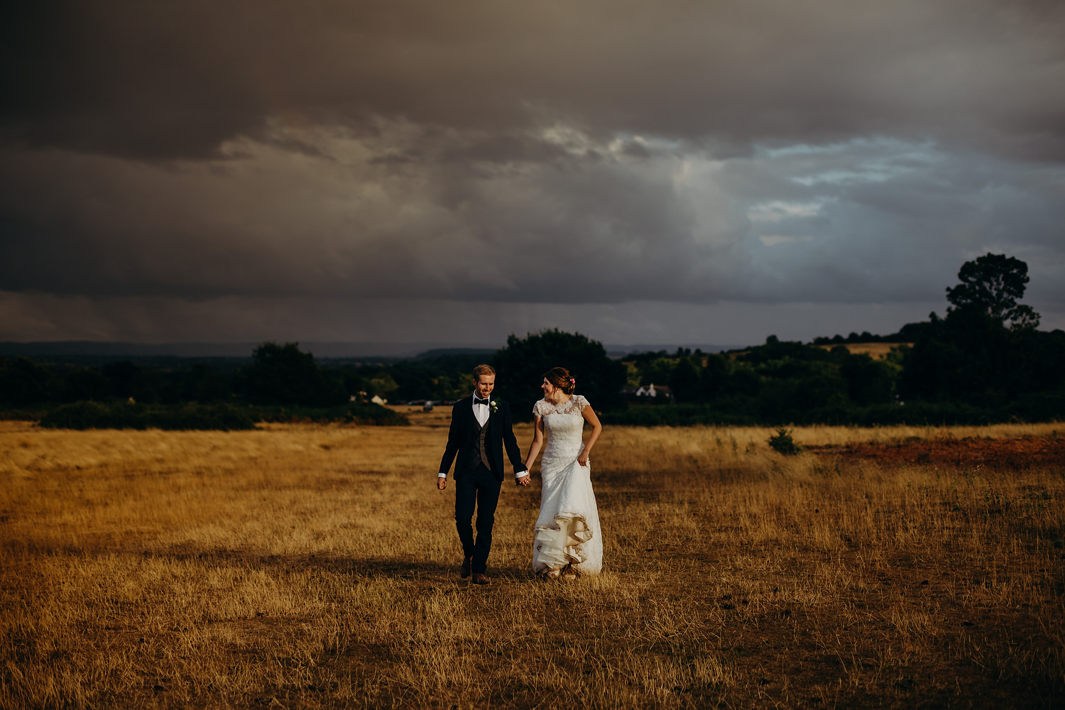 bride and groom finally getting sunshine at Malvern wedding in Worcestershire