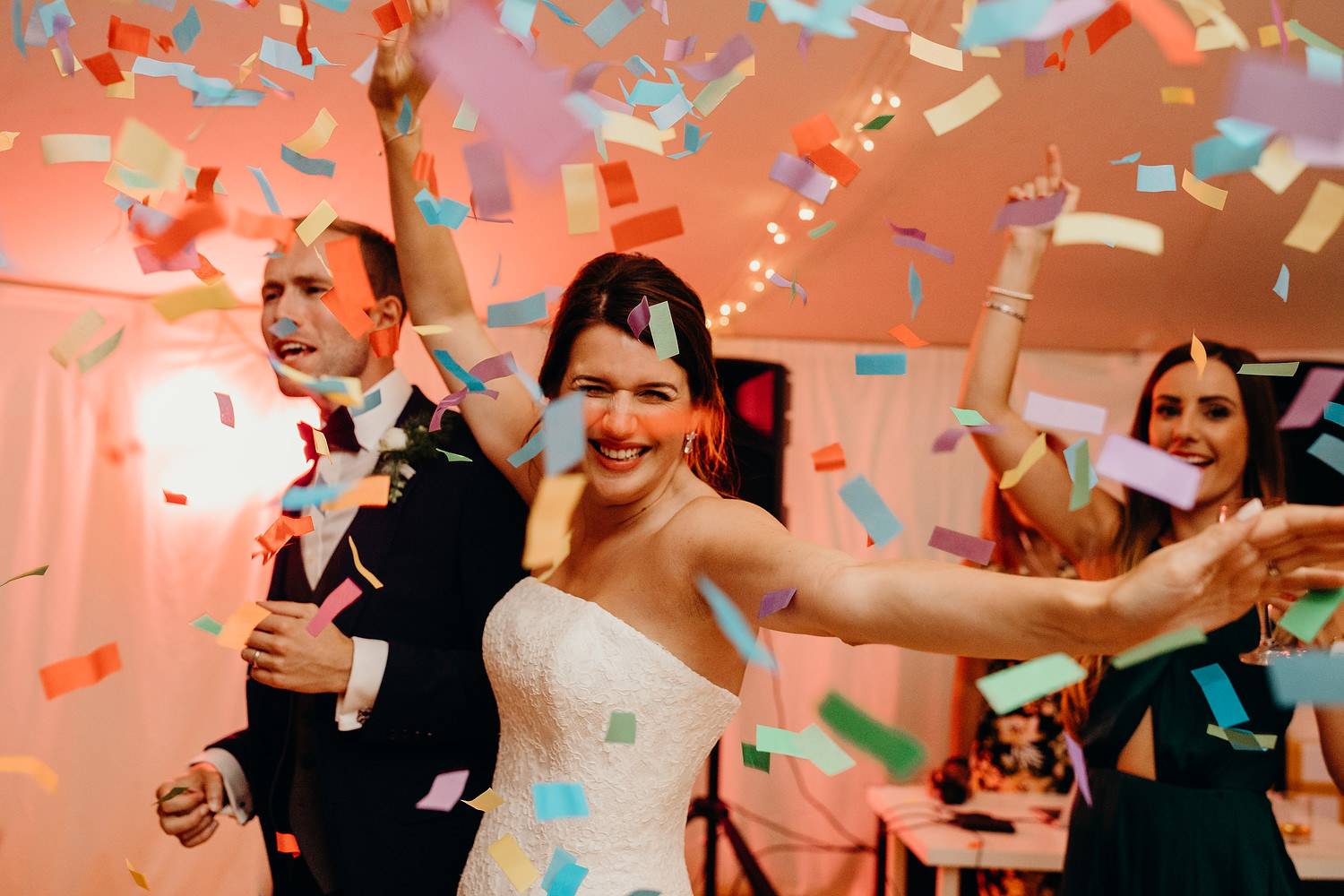 confetti photograph of bride during first dance at marquee wedding