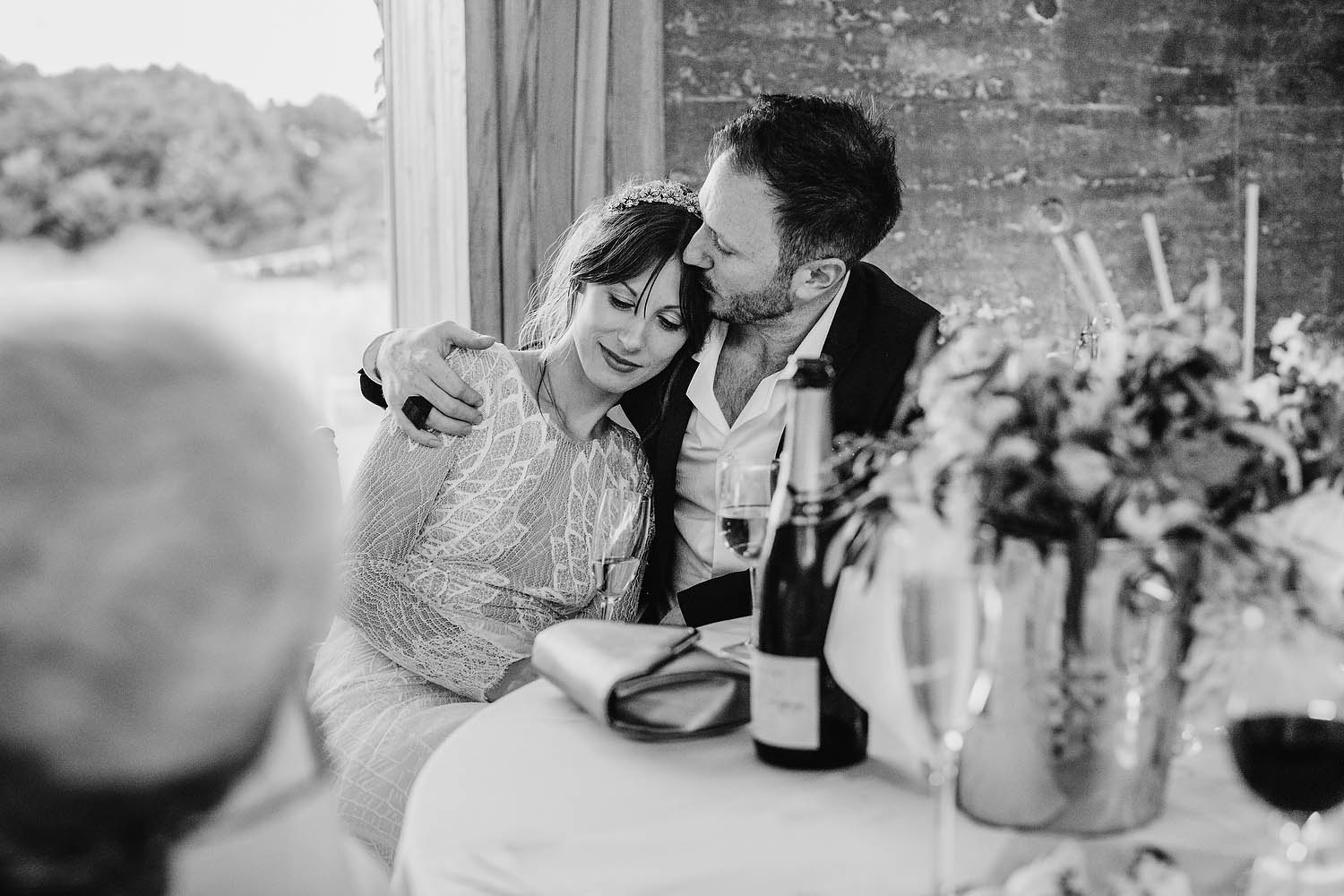 groom hugs bride during speeches in gillyflower at Gloucestershire venue