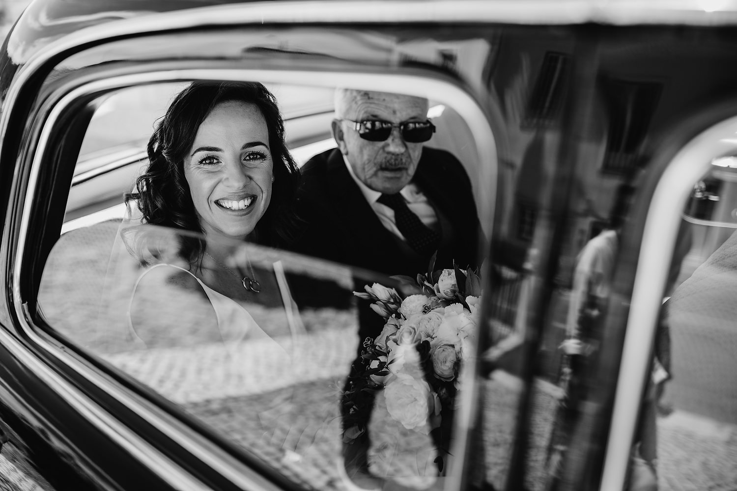 bride arriving with dad to catholic church wedding