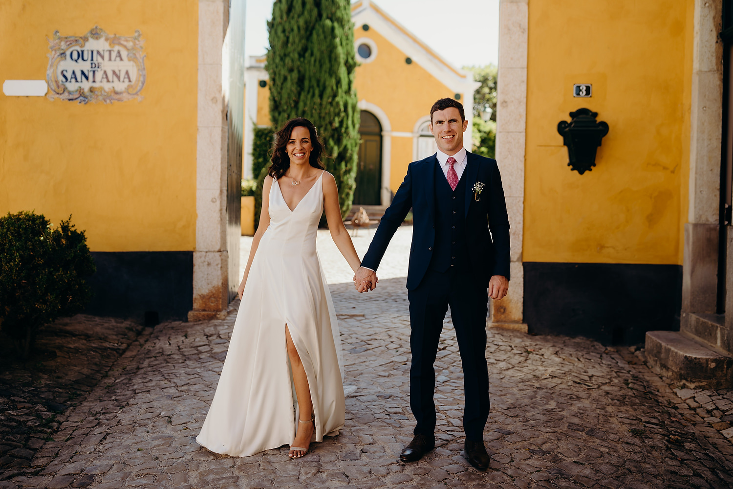 bride and groom pose for photographs at Quinta de Sant'ana