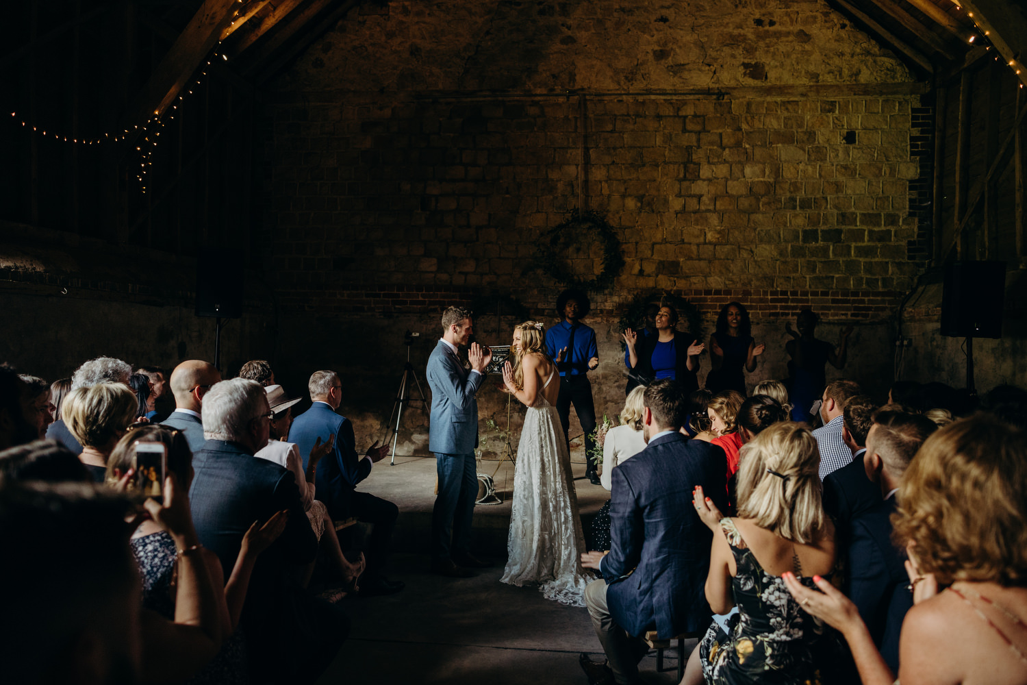 Bride and groom exchange vows at Wick Bottom Barn wedding