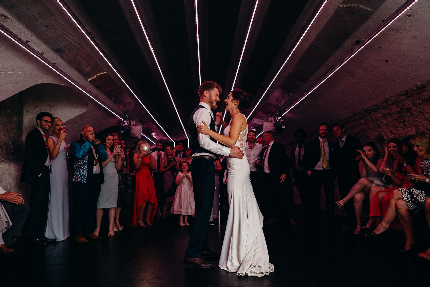 bride and groom dance at cave in St Giles house