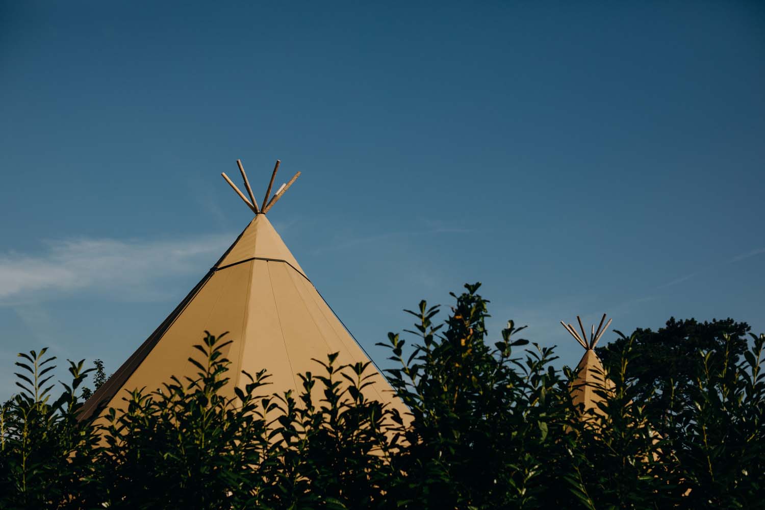 tipi with blue sky in background