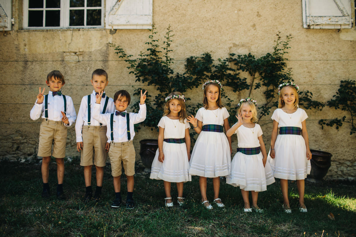 Flower girls and page boys line up before wedding in France