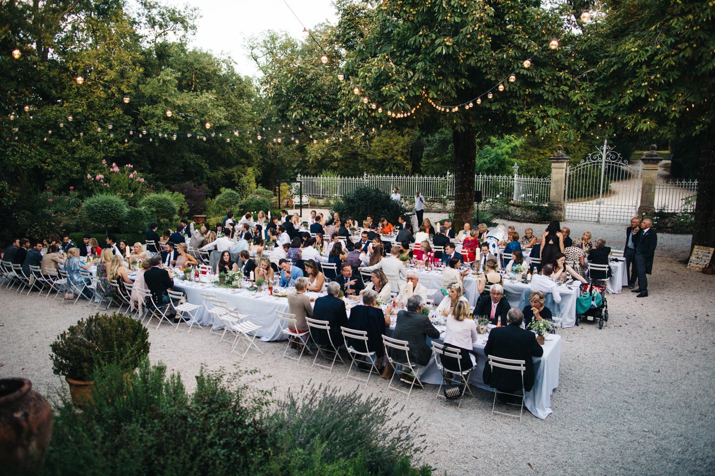 Guests seated at chateau wedding dinner near Toulouse