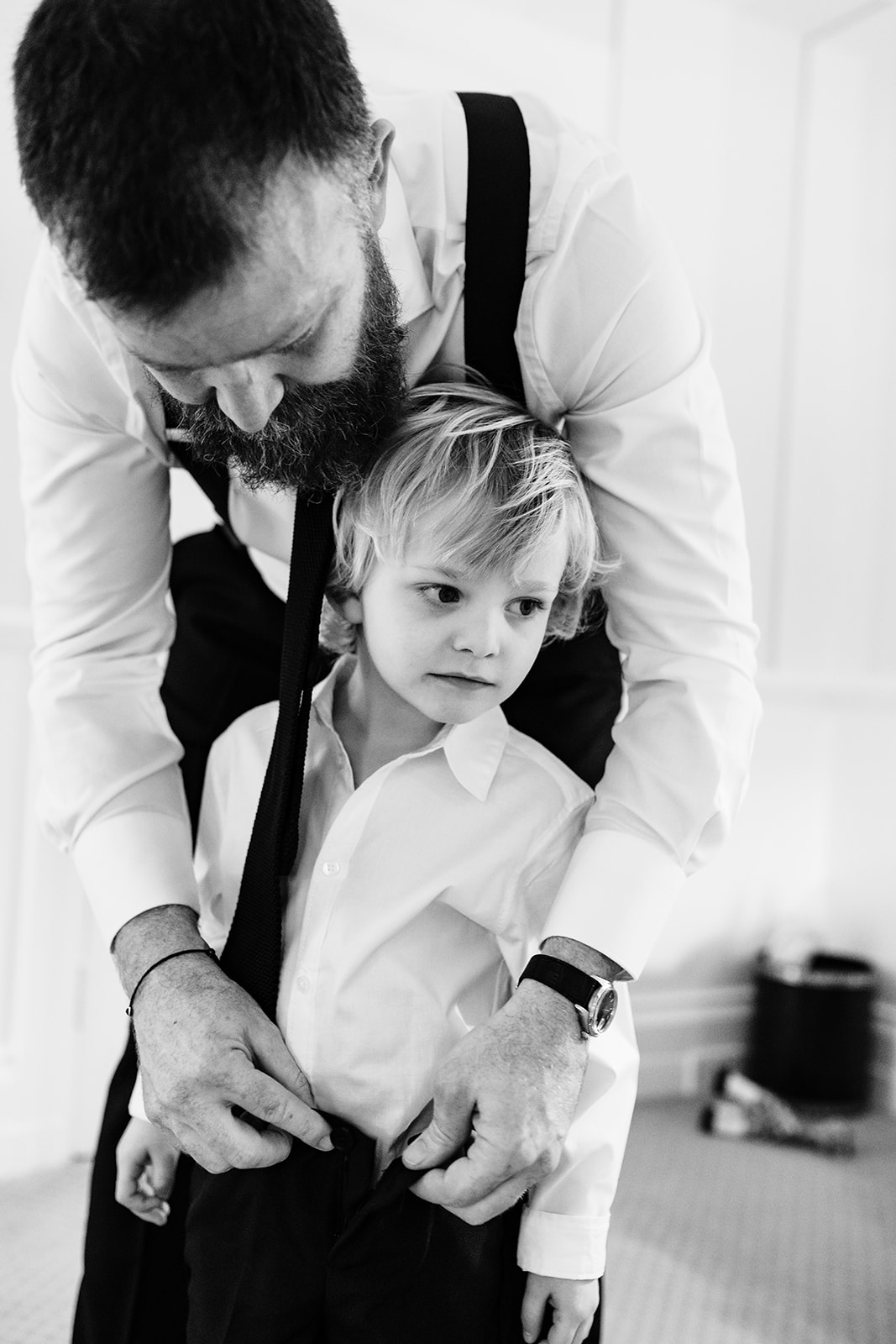 dad getting ready for his wedding with his son at Hambleton Hall
