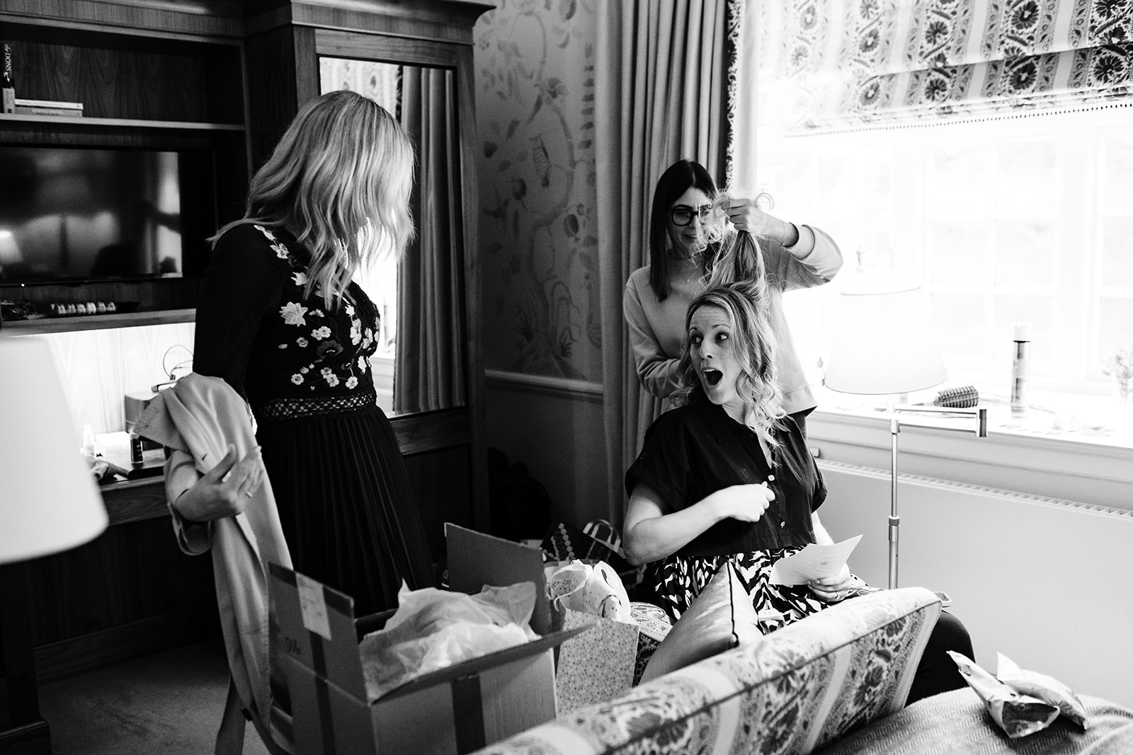bride in her room with sister at hambleton hall wedding