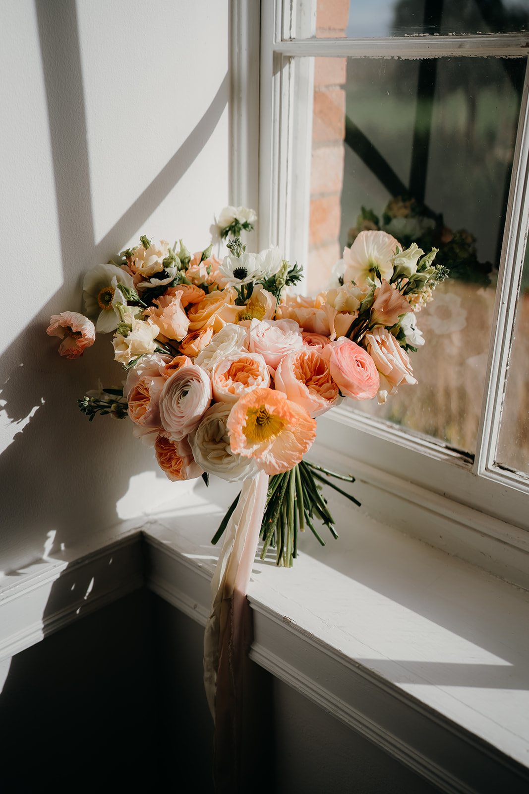 Beautiful peach floral wedding bouquet 