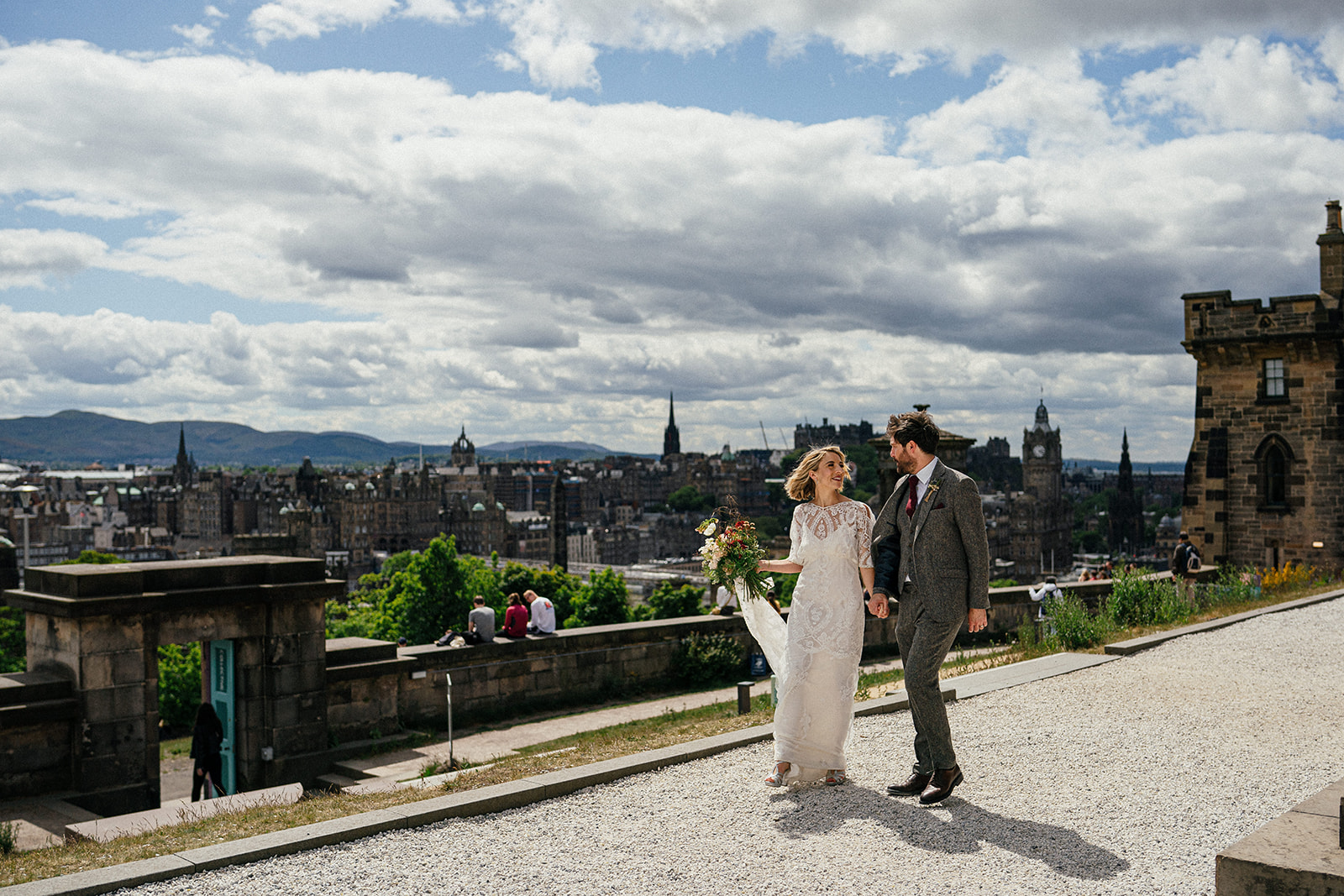 wedding couple in front Edinburgh view, skyline, Calton Hill 