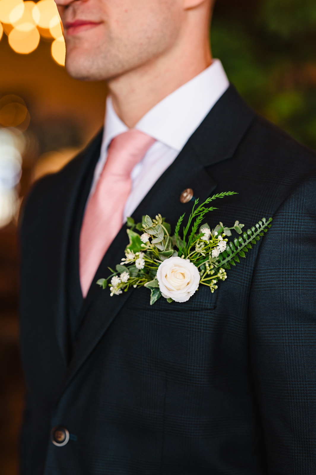 Close up of grooms boutonniere 