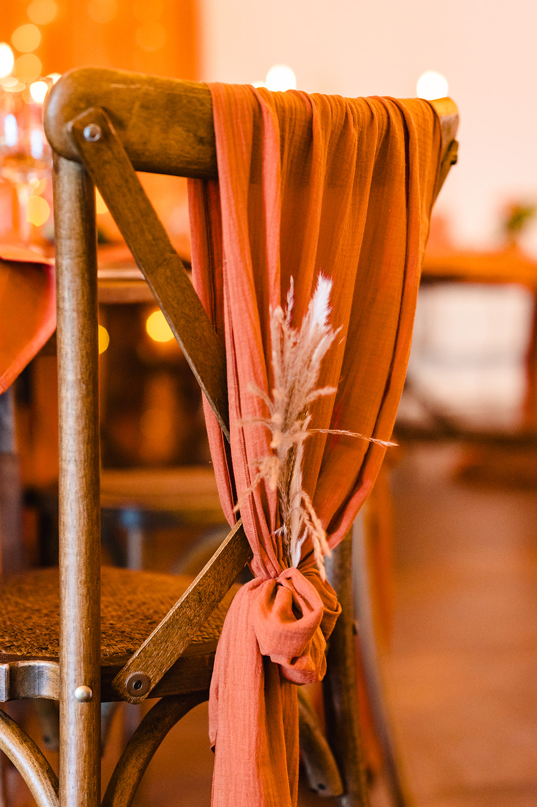 wedding chair styled with a terracotta drape at the barnsdale rutland