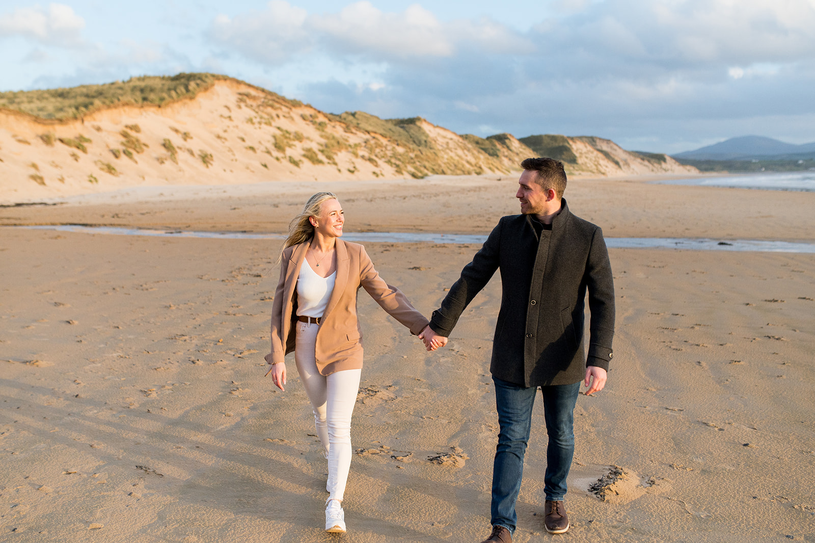 Couple on Lagg Beach Holding Hands